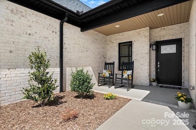 4210 Holly Cir NE, Conover, NC 28613 - view of exterior entry with covered porch and brick siding