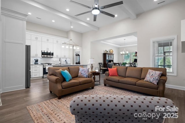 4210 Holly Cir NE, Conover, NC 28613 - living area with dark wood-style floors, a chandelier, a ceiling fan, recessed lighting, and beamed ceiling