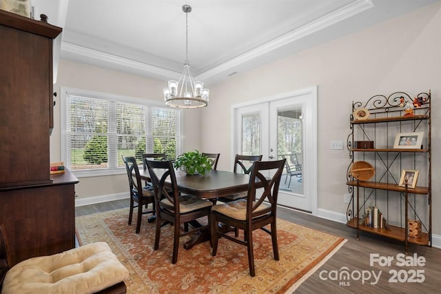 4210 Holly Cir NE, Conover, NC 28613 - dining area with wood finished floors, a tray ceiling, a chandelier, crown molding, and french doors