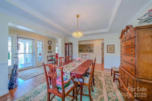 8 Creekside Way, Asheville, NC 28804 - dining area featuring a chandelier, light wood finished floors, crown molding, and a tray ceiling