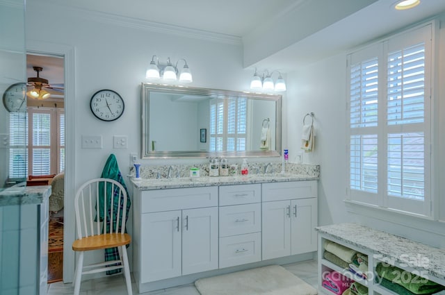 8 Creekside Way, Asheville, NC 28804 - bathroom featuring plenty of natural light, double vanity, marble look tiles, crown molding, and a ceiling fan
