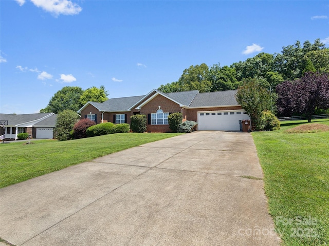 3906 Brickfield St, Hickory, NC 28602 - ranch-style home with a garage, brick siding, concrete driveway, and a front lawn