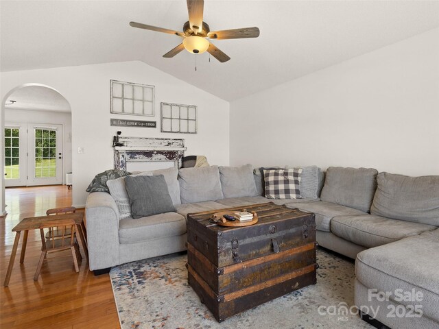 3906 Brickfield St, Hickory, NC 28602 - living room featuring arched walkways, wood finished floors, a ceiling fan, and vaulted ceiling
