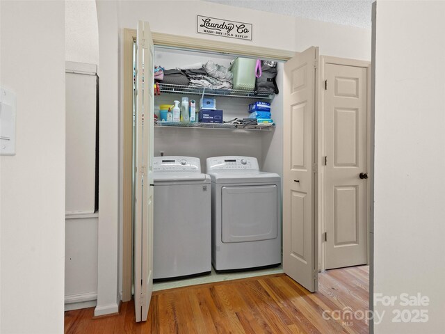 3906 Brickfield St, Hickory, NC 28602 - laundry room featuring separate washer and dryer and wood finished floors