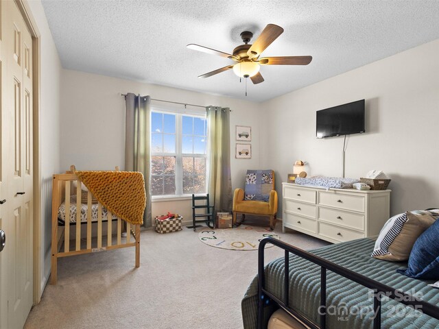 3906 Brickfield St, Hickory, NC 28602 - bedroom with carpet floors, a textured ceiling, and a ceiling fan