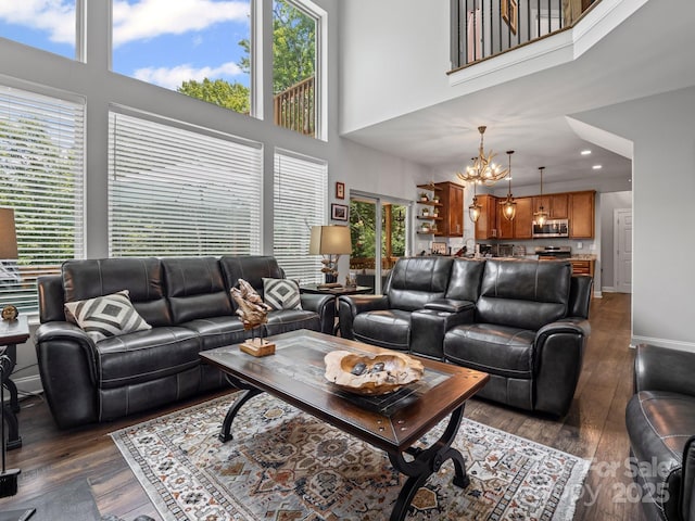 714 Bolt Rd, Lake Lure, NC 28746 - living room with a chandelier, a towering ceiling, dark wood-style floors, and recessed lighting