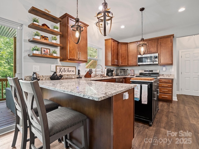 714 Bolt Rd, Lake Lure, NC 28746 - kitchen featuring appliances with stainless steel finishes, healthy amount of natural light, a peninsula, open shelves, and recessed lighting