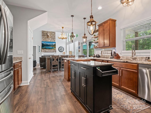 714 Bolt Rd, Lake Lure, NC 28746 - kitchen featuring appliances with stainless steel finishes, a chandelier, brown cabinetry, dark wood-type flooring, and open floor plan