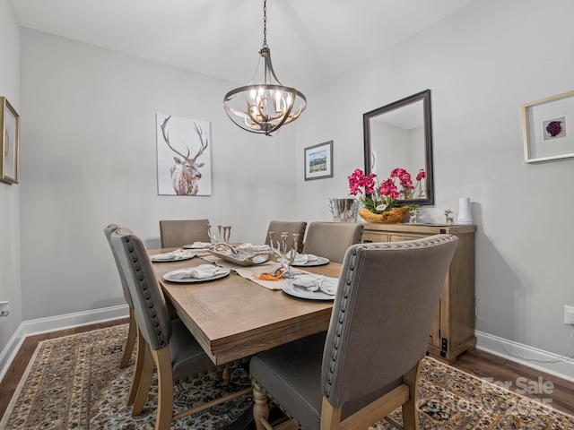 714 Bolt Rd, Lake Lure, NC 28746 - dining area with dark wood-style floors and a chandelier