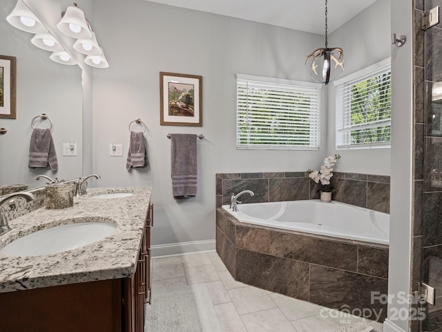 714 Bolt Rd, Lake Lure, NC 28746 - bathroom featuring double vanity, a garden tub, a chandelier, and tile patterned floors