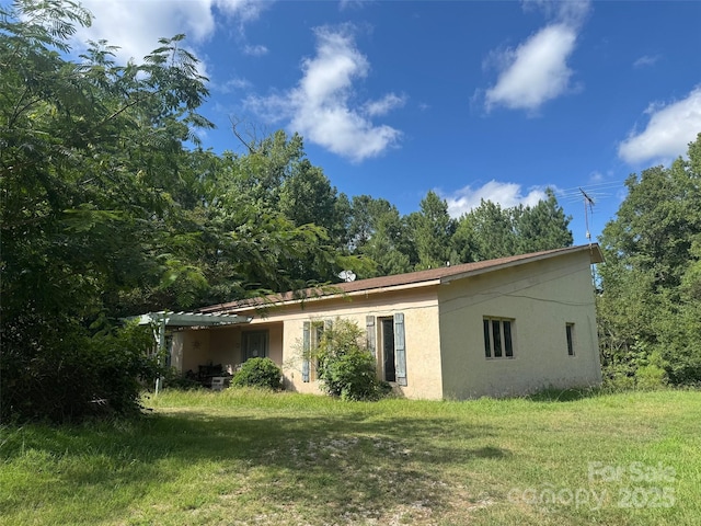 316 C E Stewart Rd, Clover, SC 29710 - view of side of property featuring stucco siding and a yard