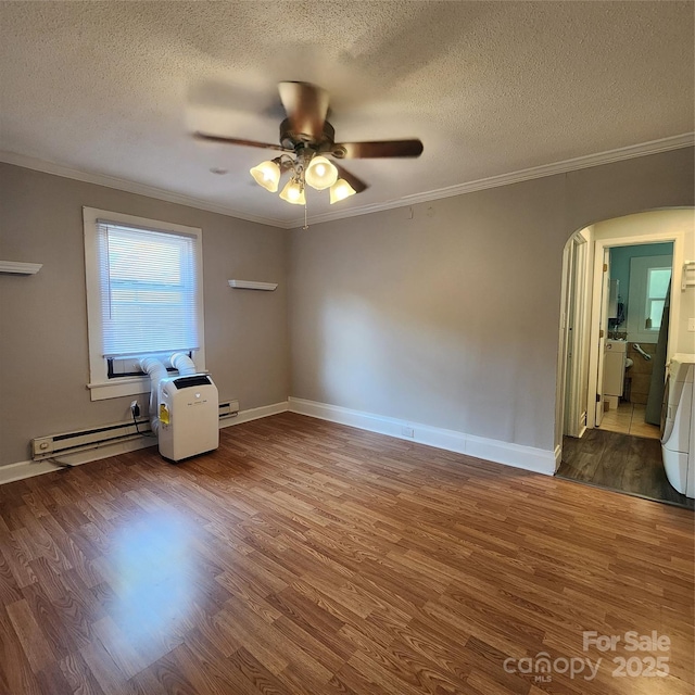 703/705 Smith St, Kannapolis, NC 28083 - spare room with ceiling fan, wood finished floors, ornamental molding, a textured ceiling, and arched walkways