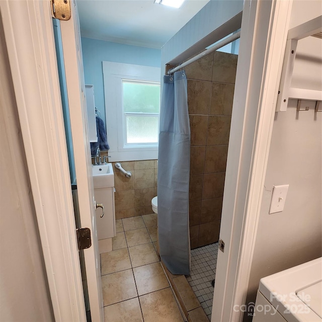 703/705 Smith St, Kannapolis, NC 28083 - bathroom with vanity, a stall shower, tile patterned floors, and tile walls