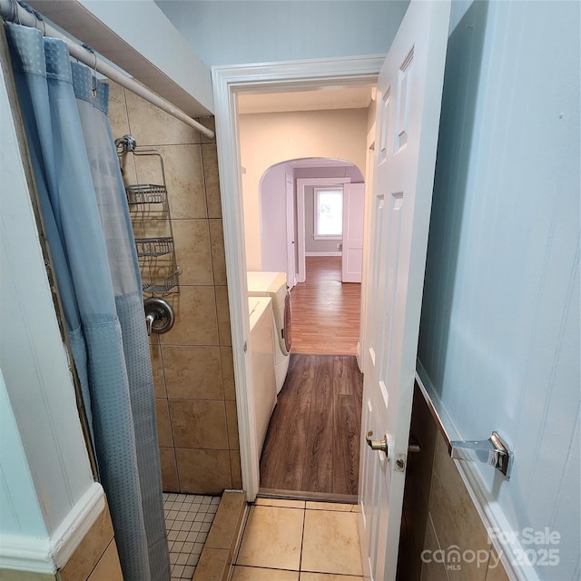 703/705 Smith St, Kannapolis, NC 28083 - bathroom featuring independent washer and dryer, a tile shower, wood finished floors, and vanity