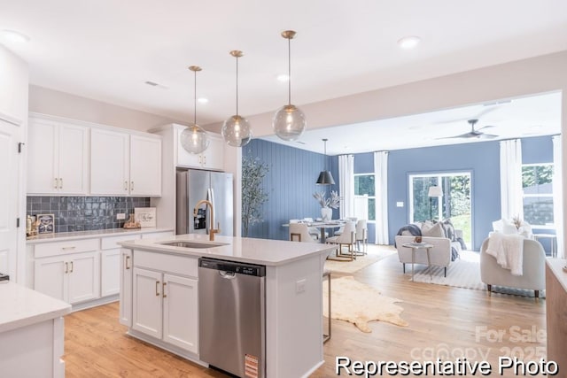 622 Station St Unit 48, Clover, SC 29710 - kitchen featuring appliances with stainless steel finishes, light countertops, open floor plan, white cabinets, and recessed lighting