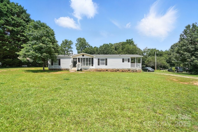 1778 N Ingleside Farm Rd, Iron Station, NC 28080 - view of front of property with entry steps, a front yard, and view of wooded area