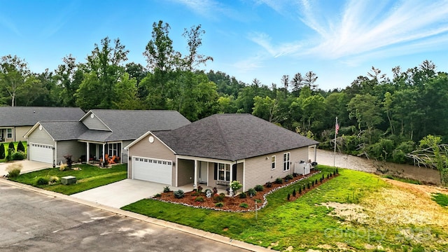 255 Eagles Lndg, Morganton, NC 28655 - view of front of home with a front yard, an attached garage, concrete driveway, covered porch, and a shingled roof