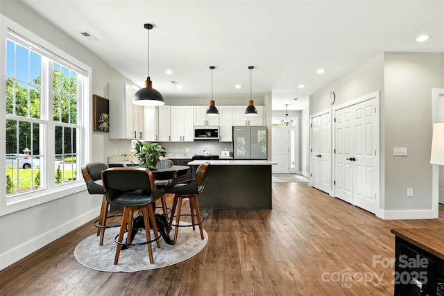 255 Eagles Lndg, Morganton, NC 28655 - kitchen featuring white cabinetry, dark wood-type flooring, freestanding refrigerator, decorative light fixtures, and recessed lighting