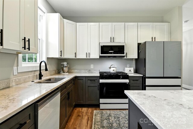 255 Eagles Lndg, Morganton, NC 28655 - kitchen featuring white appliances, dark wood finished floors, light stone counters, and white cabinetry