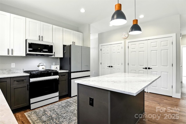 255 Eagles Lndg, Morganton, NC 28655 - kitchen featuring gas stove, freestanding refrigerator, white cabinets, dark wood-style floors, and recessed lighting