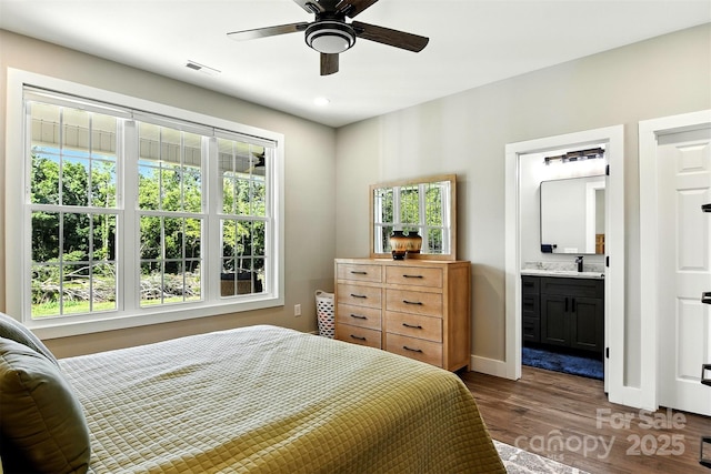 255 Eagles Lndg, Morganton, NC 28655 - bedroom with multiple windows, dark wood finished floors, ensuite bath, and recessed lighting