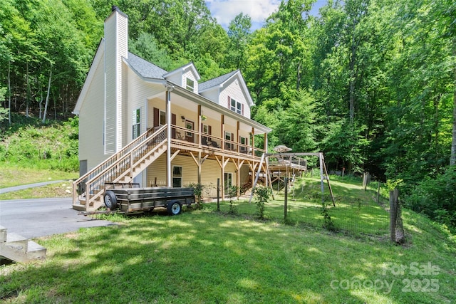 222 Fox Creek Rd, Mars Hill, NC 28754 - view of front of home with stairway, a front lawn, a chimney, a wooded view, and a deck