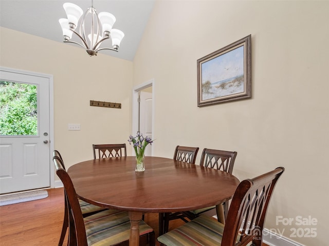 222 Fox Creek Rd, Mars Hill, NC 28754 - dining space featuring a chandelier, lofted ceiling, and wood finished floors