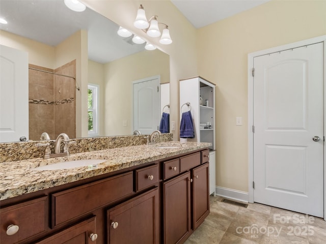 222 Fox Creek Rd, Mars Hill, NC 28754 - bathroom featuring double vanity and tiled shower