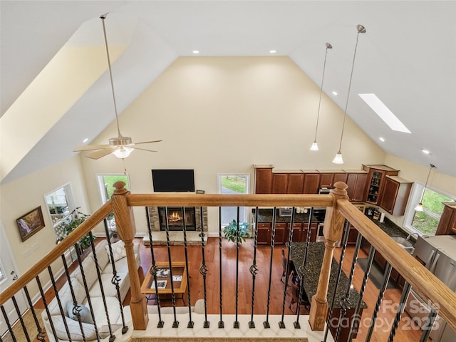222 Fox Creek Rd, Mars Hill, NC 28754 - hallway with high vaulted ceiling, a skylight, recessed lighting, wood finished floors, and an upstairs landing