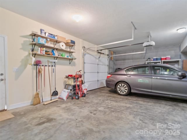 222 Fox Creek Rd, Mars Hill, NC 28754 - garage with a garage door opener and baseboards