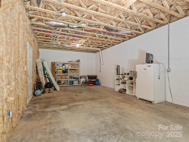 222 Fox Creek Rd, Mars Hill, NC 28754 - basement with freestanding refrigerator and concrete block wall