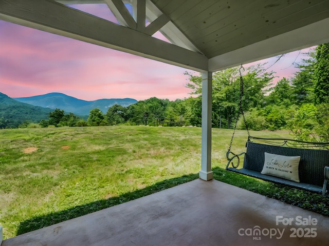 198 Sugarbush Pt, Lake Lure, NC 28746 - view of grassy yard with a mountain view and a patio