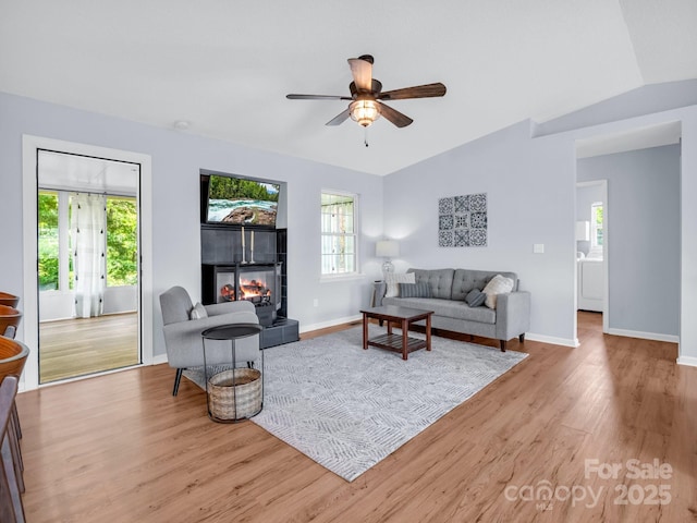 198 Sugarbush Pt, Lake Lure, NC 28746 - living area featuring a tiled fireplace, light wood-type flooring, and ceiling fan