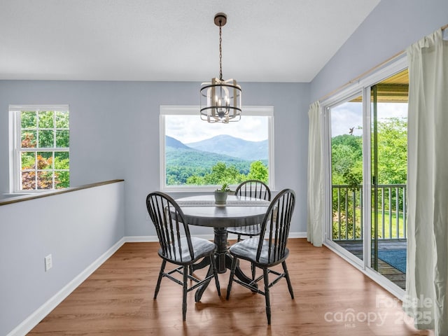 198 Sugarbush Pt, Lake Lure, NC 28746 - dining room featuring a chandelier and wood finished floors