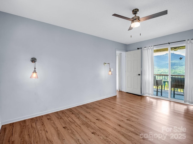 198 Sugarbush Pt, Lake Lure, NC 28746 - unfurnished room featuring wood finished floors and a ceiling fan