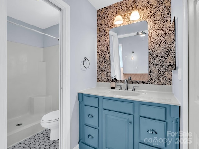 198 Sugarbush Pt, Lake Lure, NC 28746 - bathroom featuring vanity, a shower, a ceiling fan, and wallpapered walls