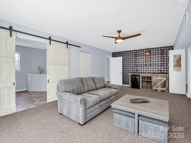 198 Sugarbush Pt, Lake Lure, NC 28746 - carpeted living area featuring a barn door and ceiling fan