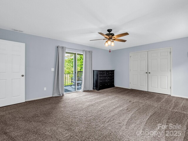 198 Sugarbush Pt, Lake Lure, NC 28746 - unfurnished bedroom with access to outside, carpet floors, a ceiling fan, and a closet