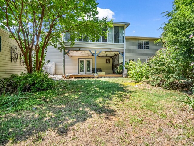 198 Sugarbush Pt, Lake Lure, NC 28746 - back of house featuring french doors, a yard, and a sunroom