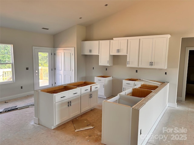 3500 14th Ave SW, Hickory, NC 28602 - kitchen featuring white cabinetry, a center island, and high vaulted ceiling