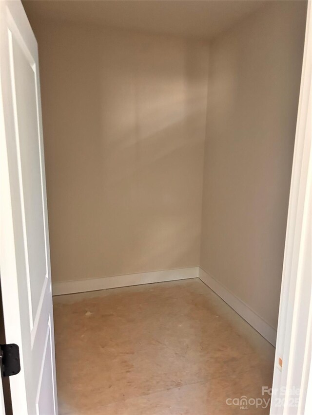 3500 14th Ave SW, Hickory, NC 28602 - empty room featuring unfinished concrete flooring and baseboards