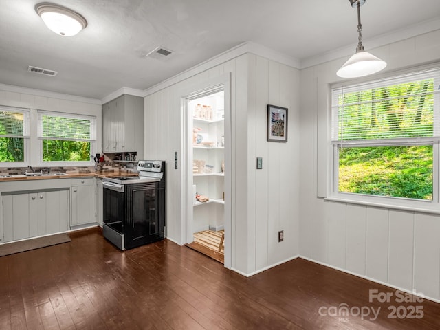 1463 Carolina Dr, Tryon, NC 28782 - kitchen with electric stove, ornamental molding, dark wood-style flooring, and hanging light fixtures