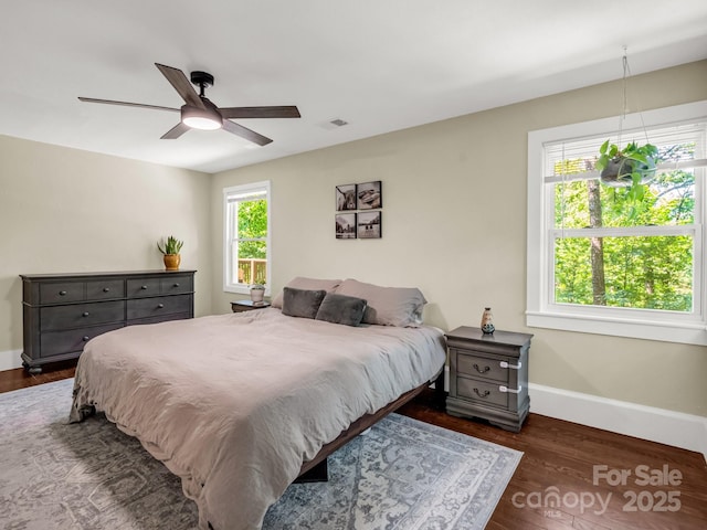 1463 Carolina Dr, Tryon, NC 28782 - bedroom with dark wood-style flooring and a ceiling fan