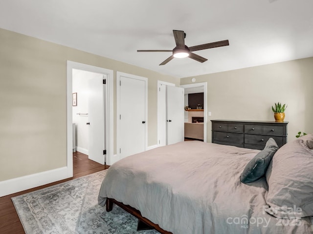 1463 Carolina Dr, Tryon, NC 28782 - bedroom featuring wood finished floors, ensuite bath, and a ceiling fan