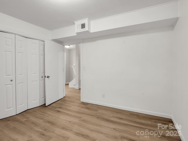 1463 Carolina Dr, Tryon, NC 28782 - unfurnished bedroom featuring light wood-style floors and a closet