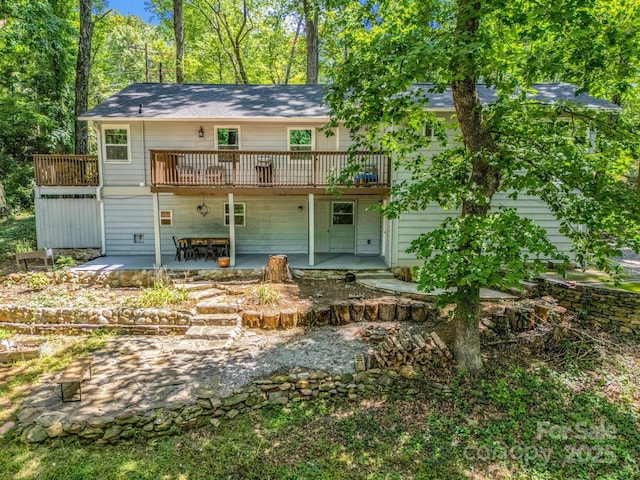1463 Carolina Dr, Tryon, NC 28782 - rear view of house featuring a wooden deck and a patio