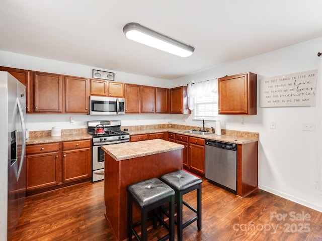 4316 Davis Meadows Dr, Charlotte, NC 28216 - kitchen with appliances with stainless steel finishes, brown cabinets, light countertops, and dark wood finished floors