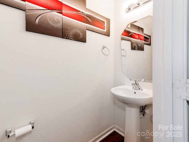 4316 Davis Meadows Dr, Charlotte, NC 28216 - bathroom with baseboards and wood finished floors