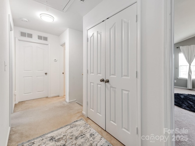 4316 Davis Meadows Dr, Charlotte, NC 28216 - hallway featuring light colored carpet and attic access