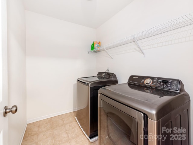 4316 Davis Meadows Dr, Charlotte, NC 28216 - laundry area featuring washing machine and clothes dryer and baseboards